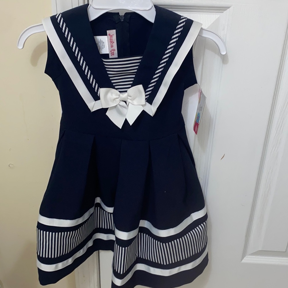 Size 4T sailor dress. Super cute. Bow detail on front and tie on back waist.
